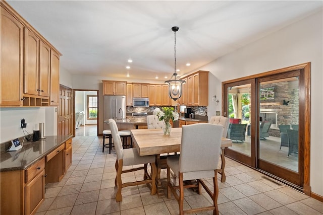 321 Ivy Dr, Pine Twp Nal, PA 15044 - dining area featuring recessed lighting, light tile patterned flooring, a chandelier, and baseboards