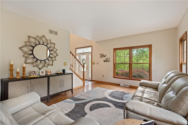 321 Ivy Dr, Pine Twp Nal, PA 15044 - living room with wood finished floors and stairway