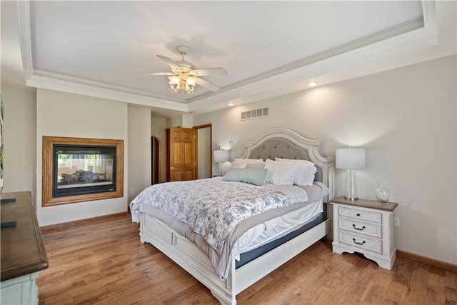 321 Ivy Dr, Pine Twp Nal, PA 15044 - bedroom with a raised ceiling, wood finished floors, recessed lighting, ornamental molding, and a ceiling fan