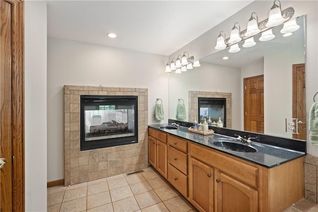 321 Ivy Dr, Pine Twp Nal, PA 15044 - bathroom with a multi sided fireplace, double vanity, tile patterned flooring, and recessed lighting