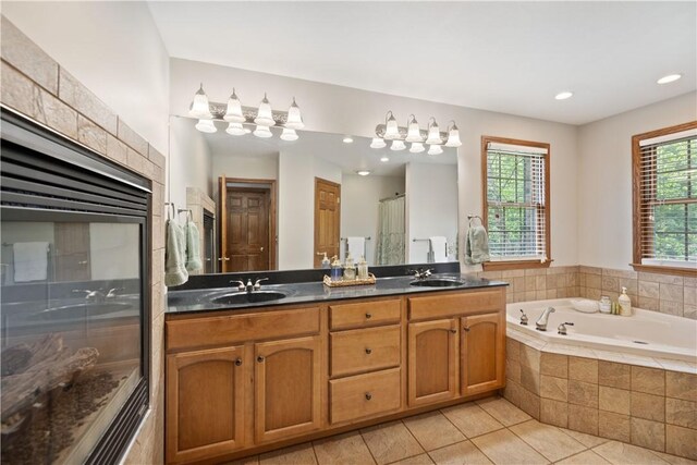321 Ivy Dr, Pine Twp Nal, PA 15044 - bathroom with a stall shower, double vanity, a whirlpool tub, tile patterned floors, and recessed lighting