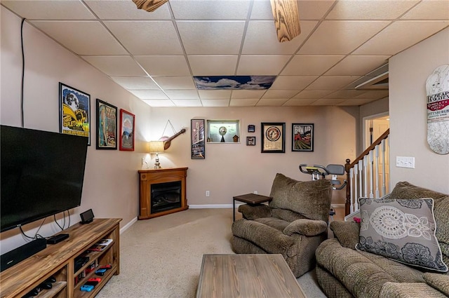 34 Max St, Hempfield Twp Wml, PA 15601 - carpeted living area with a drop ceiling, stairway, a fireplace, and baseboards