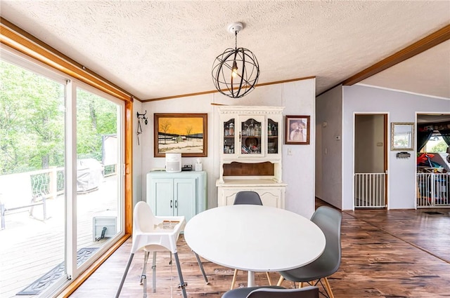34 Max St, Hempfield Twp Wml, PA 15601 - dining room featuring vaulted ceiling, a textured ceiling, wood finished floors, ornamental molding, and a chandelier