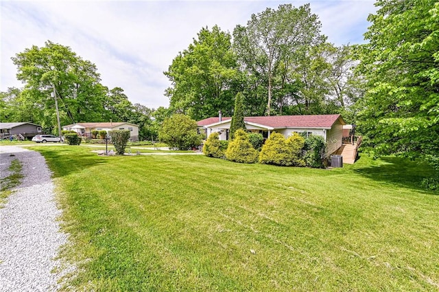 34 Max St, Hempfield Twp Wml, PA 15601 - view of green lawn featuring central AC unit, view of scattered trees, and driveway