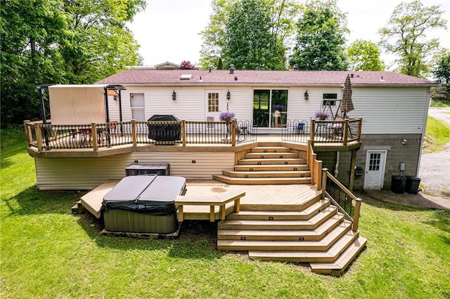34 Max St, Hempfield Twp Wml, PA 15601 - rear view of property featuring a hot tub, a deck, stairway, and a lawn
