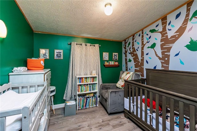 34 Max St, Hempfield Twp Wml, PA 15601 - bedroom featuring wood finished floors, a textured ceiling, crown molding, and baseboards