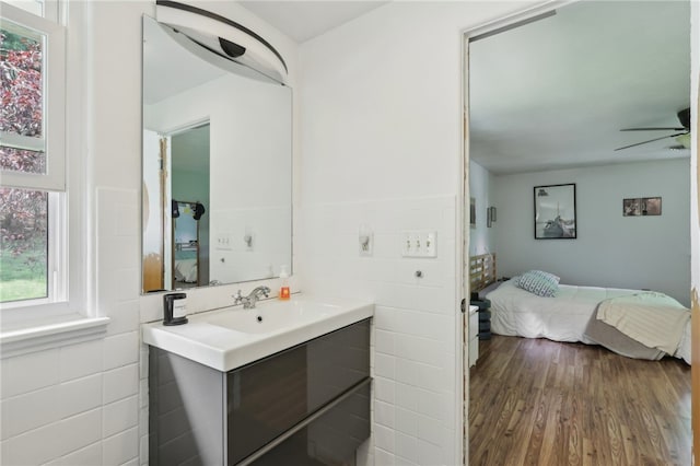 643 Croyland Ave, Indiana Boro, PA 15701 - bathroom with ensuite bath, vanity, tile walls, wood finished floors, and a ceiling fan