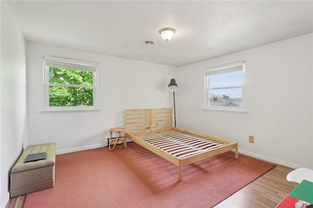 643 Croyland Ave, Indiana Boro, PA 15701 - bedroom featuring multiple windows, baseboards, and wood finished floors