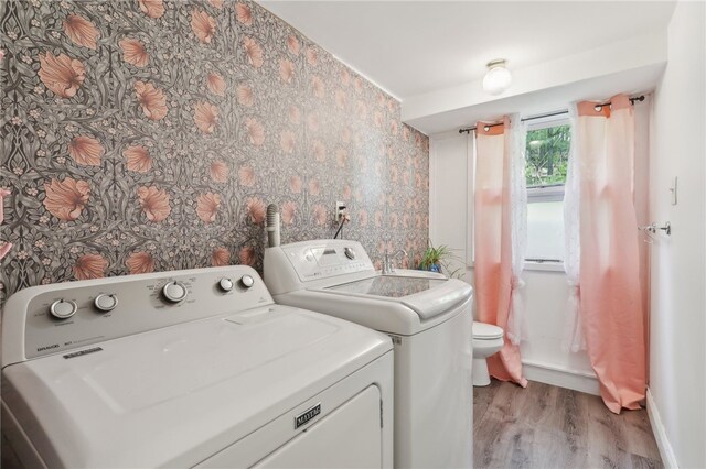 643 Croyland Ave, Indiana Boro, PA 15701 - washroom with light wood-style floors, washer and dryer, wallpapered walls, and baseboards