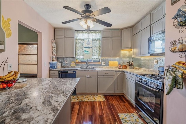 346 Pine St, Ambridge, PA 15003 - kitchen with range with gas stovetop, gray cabinetry, a sink, dark wood-style flooring, and a textured ceiling