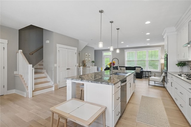 349 Azalea Dr, Peters Twp, PA 15367 - kitchen with appliances with stainless steel finishes, a sink, light wood-style floors, white cabinetry, and recessed lighting