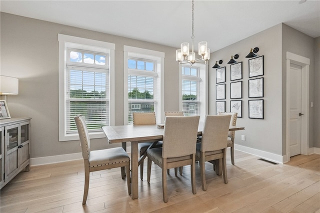 349 Azalea Dr, Peters Twp, PA 15367 - dining area with light wood-style floors, a chandelier, and baseboards