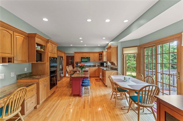 104 Autumn Way, Peters Twp, PA 15367 - kitchen with black appliances, open shelves, light wood-style floors, recessed lighting, and a center island