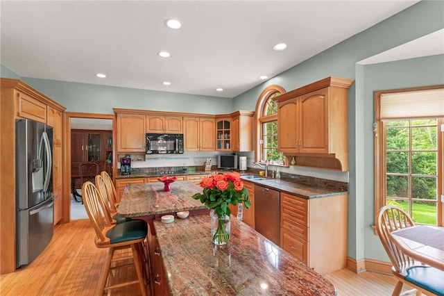 104 Autumn Way, Peters Twp, PA 15367 - kitchen with black appliances, a kitchen bar, plenty of natural light, a sink, and recessed lighting