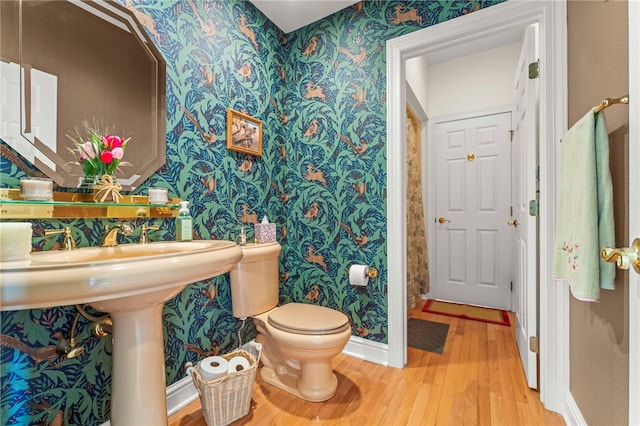 104 Autumn Way, Peters Twp, PA 15367 - bathroom with wallpapered walls, wood finished floors, toilet, and baseboards