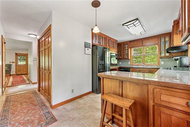 431 Scenic Dr W, Pike Run Twp, PA 15427 - kitchen with black appliances, tile countertops, under cabinet range hood, decorative backsplash, and brown cabinets