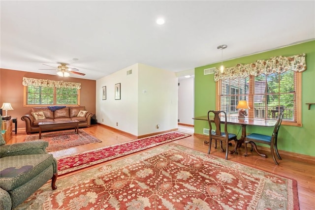 431 Scenic Dr W, Pike Run Twp, PA 15427 - living area with wood finished floors, baseboards, and a ceiling fan