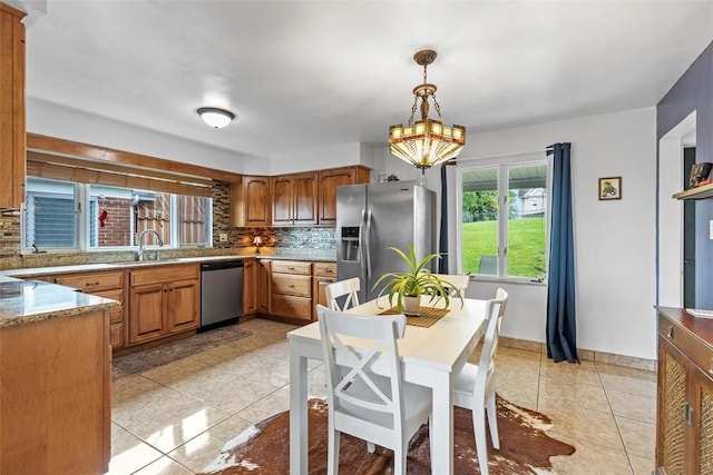 920 Maple Ave, Castle Shannon, PA 15234 - kitchen featuring stainless steel appliances, backsplash, light tile patterned flooring, a sink, and a chandelier