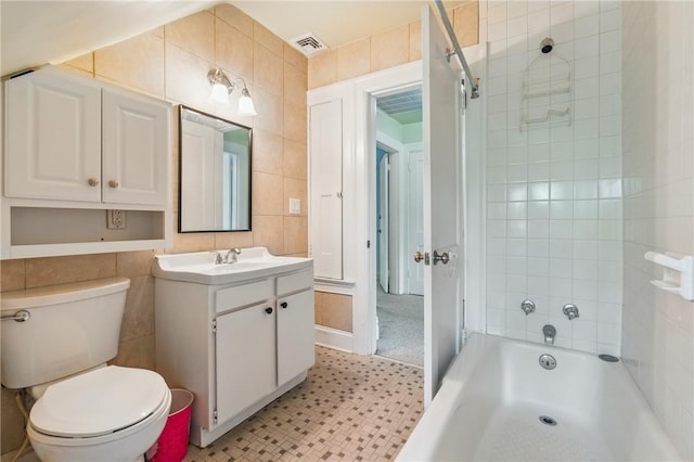 1800 Wightman St, Squirrel Hill, PA 15217 - bathroom with tile walls, vanity, toilet, and washtub / shower combination