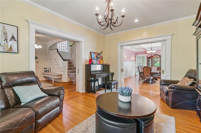 1800 Wightman St, Squirrel Hill, PA 15217 - living room with a chandelier, stairs, light wood-style flooring, healthy amount of natural light, and ornamental molding