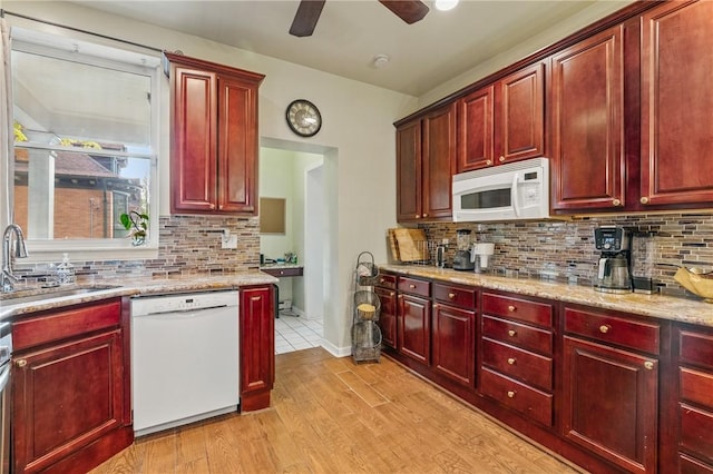 1800 Wightman St, Squirrel Hill, PA 15217 - kitchen with white appliances, reddish brown cabinets, and a sink