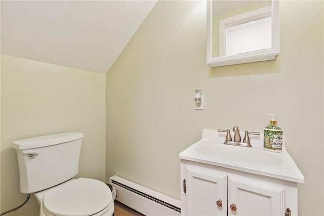 1800 Wightman St, Squirrel Hill, PA 15217 - half bath with a baseboard heating unit, vanity, toilet, and lofted ceiling