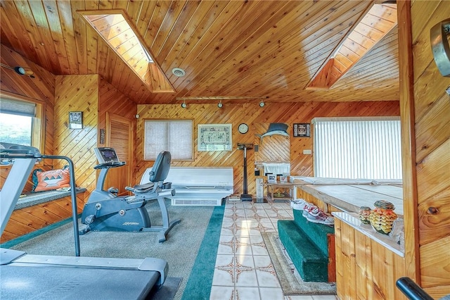 3098 Clay Pike St, Sewickley Twp, PA 15637 - exercise area featuring a skylight, vaulted ceiling, wood walls, wooden ceiling, and tile patterned flooring