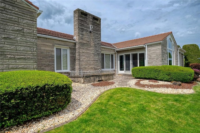 3098 Clay Pike St, Sewickley Twp, PA 15637 - rear view of house featuring a chimney and a yard