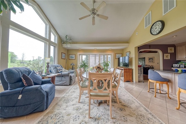 3098 Clay Pike St, Sewickley Twp, PA 15637 - dining space with high vaulted ceiling, light tile patterned flooring, a ceiling fan, and arched walkways