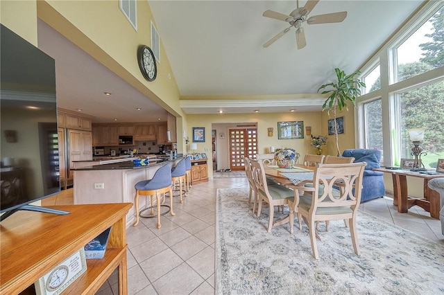 3098 Clay Pike St, Sewickley Twp, PA 15637 - dining area with light tile patterned floors, high vaulted ceiling, a ceiling fan, and recessed lighting