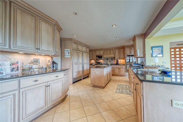 3098 Clay Pike St, Sewickley Twp, PA 15637 - kitchen with appliances with stainless steel finishes, light tile patterned flooring, decorative backsplash, dark stone countertops, and recessed lighting