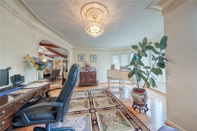 3098 Clay Pike St, Sewickley Twp, PA 15637 - home office featuring arched walkways, ornamental molding, light wood-type flooring, a chandelier, and baseboards