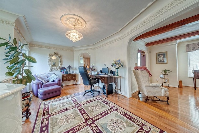 3098 Clay Pike St, Sewickley Twp, PA 15637 - home office with arched walkways, wood finished floors, crown molding, a chandelier, and baseboards
