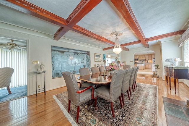 3098 Clay Pike St, Sewickley Twp, PA 15637 - dining room featuring a ceiling fan, arched walkways, wood finished floors, coffered ceiling, and beamed ceiling