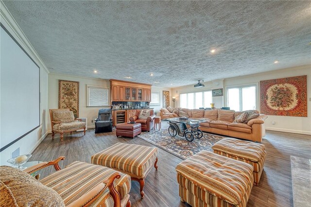 3098 Clay Pike St, Sewickley Twp, PA 15637 - living room featuring wine cooler, baseboards, a textured ceiling, ornamental molding, and recessed lighting