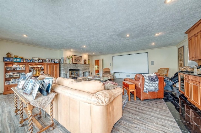 3098 Clay Pike St, Sewickley Twp, PA 15637 - living area featuring a textured ceiling, recessed lighting, a fireplace, and crown molding
