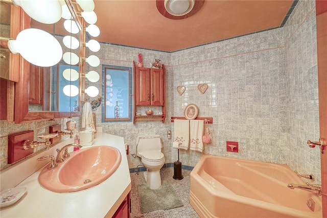 3098 Clay Pike St, Sewickley Twp, PA 15637 - full bath with a bath, vanity, toilet, tile patterned floors, and tile walls