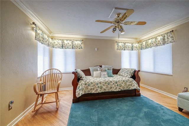 3098 Clay Pike St, Sewickley Twp, PA 15637 - bedroom featuring wood finished floors, baseboards, ornamental molding, a ceiling fan, and a textured wall