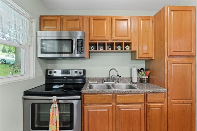 1332 Rte 519, North Strabane, PA 15330 - kitchen featuring stainless steel appliances, a sink, and brown cabinetry