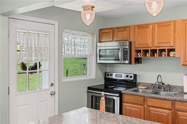 1332 Rte 519, North Strabane, PA 15330 - kitchen featuring stainless steel appliances, a sink, and brown cabinetry
