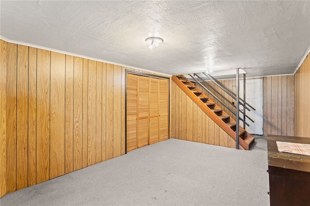 1332 Rte 519, North Strabane, PA 15330 - finished basement with wood walls, carpet flooring, stairway, and a textured ceiling