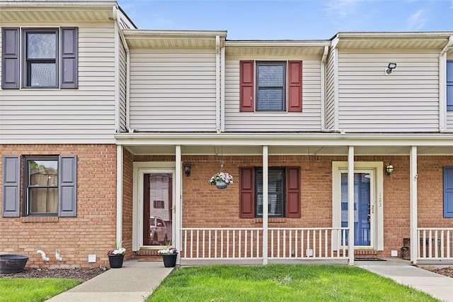 121 Woodhaven Dr, Seven Fields Boro, PA 16046 - townhome / multi-family property with covered porch and brick siding
