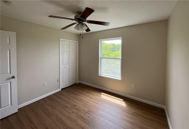 259 Grace Manor Dr, Robinson Twp Nwa, PA 15108 - unfurnished bedroom featuring baseboards, wood finished floors, a closet, and ceiling fan
