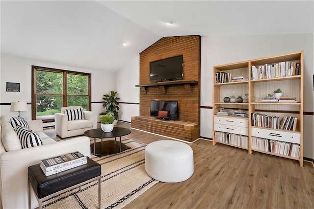 4117 Kellington Ct, Murrysville, PA 15668 - living room featuring lofted ceiling, wood finished floors, and a fireplace