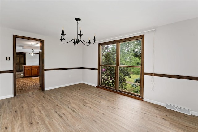 4117 Kellington Ct, Murrysville, PA 15668 - unfurnished room with a chandelier and light wood-type flooring