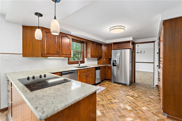 4117 Kellington Ct, Murrysville, PA 15668 - kitchen with stainless steel appliances, a peninsula, brick patterned floors, brown cabinets, and pendant lighting