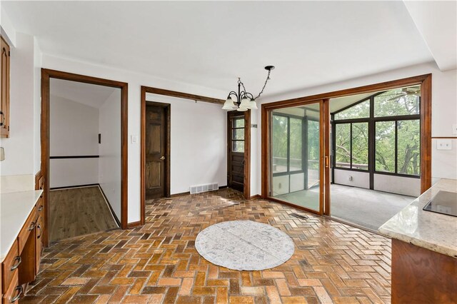 4117 Kellington Ct, Murrysville, PA 15668 - unfurnished dining area with a chandelier and brick floors