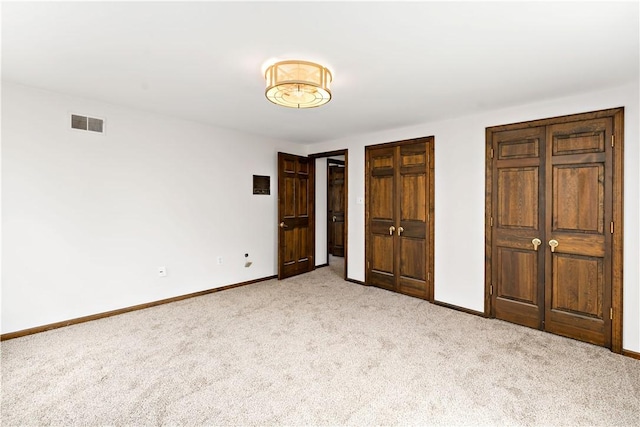 4117 Kellington Ct, Murrysville, PA 15668 - unfurnished bedroom with carpet floors and two closets