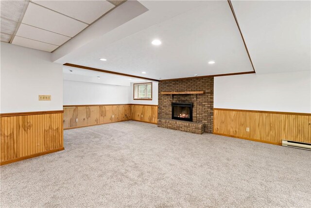 4117 Kellington Ct, Murrysville, PA 15668 - unfurnished living room featuring wainscoting, recessed lighting, carpet, wooden walls, and a brick fireplace