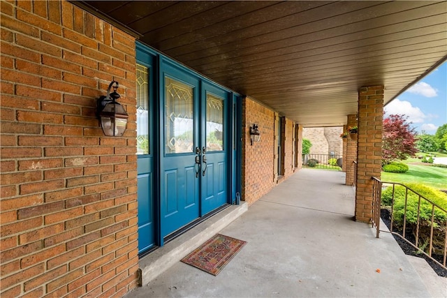 4117 Kellington Ct, Murrysville, PA 15668 - view of exterior entry with a porch and brick siding
